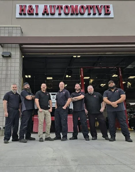 h&i automotive team in front of store
